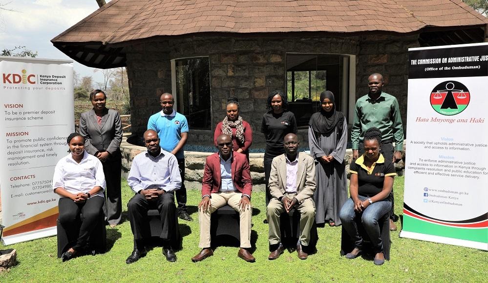 The KDIC Complaints Handling Committee is joined by the CAJ team led by Vice Chair Washington Sati, for a group photo following their training in Naivasha.