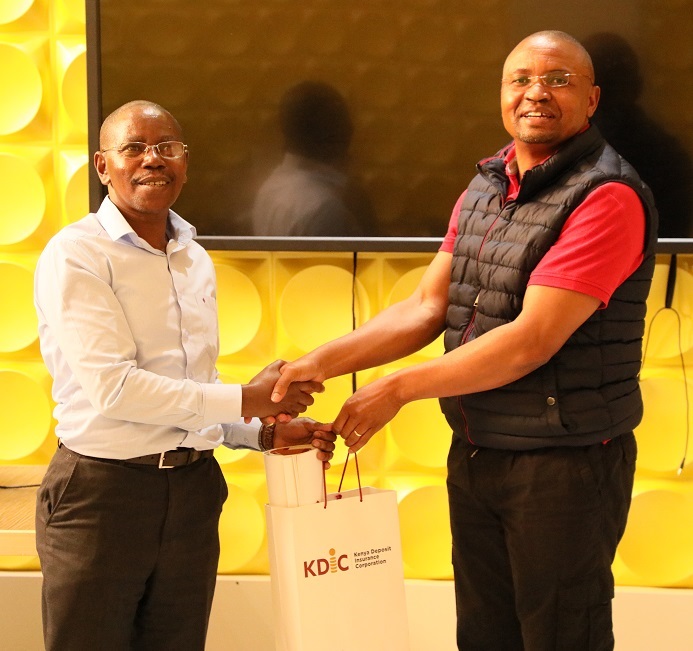 Those were great insights........KDIC's General Manager (Corporate Services) presents a gift pack to Mr. Peter Kamau (Lead trainer) of PSPMU.