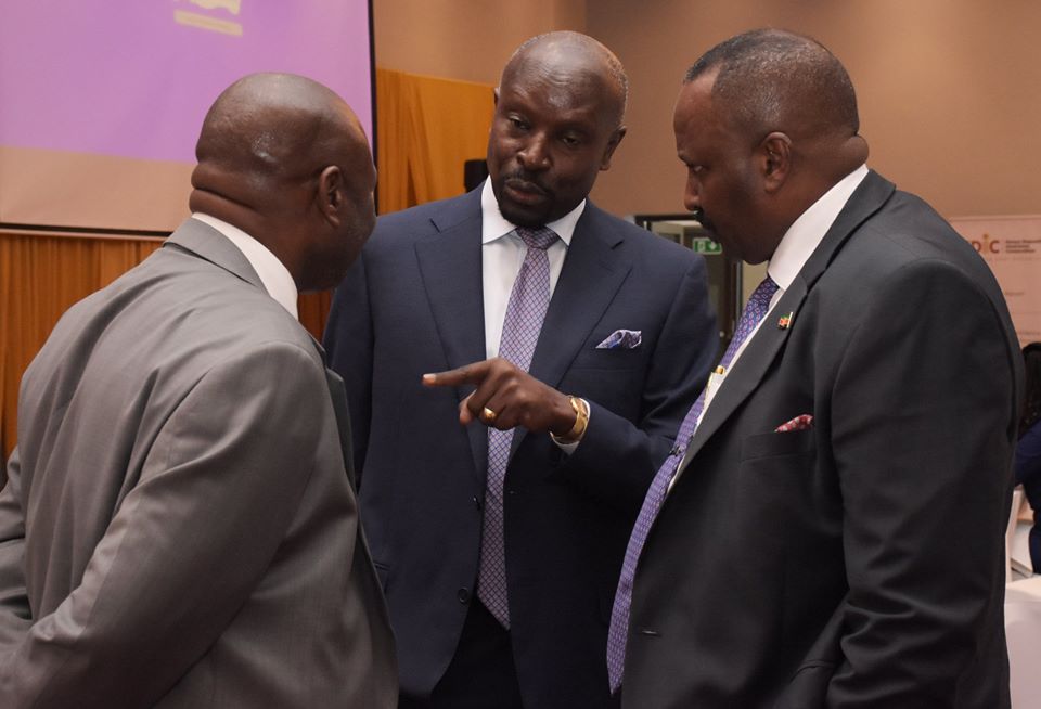 Putting heads together....KDIC Chairman Mr. Teko Lopoyetum (Left) CEO Mr. Mohamud Mohamud (Right) consult with CBK Chairman Mr. Mohammed Nyaoga shortly after the event.