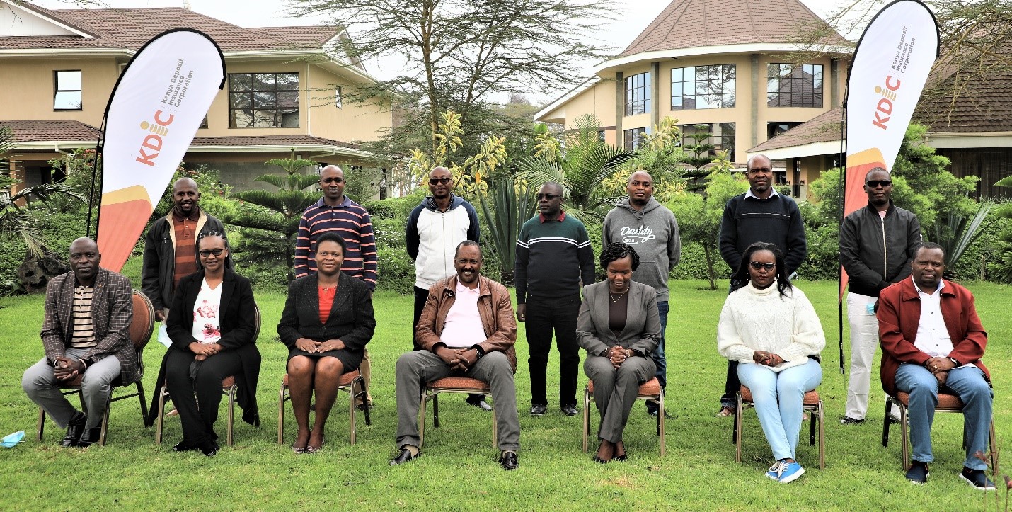 Senior Management led by Team Leader Mr. Mohamud A. Mohamud pose for a group photo alongside facilitators from KEBS.