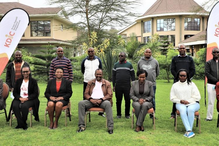 Senior Management led by Team Leader Mr. Mohamud A. Mohamud pose for a group photo alongside facilitators from KEBS.